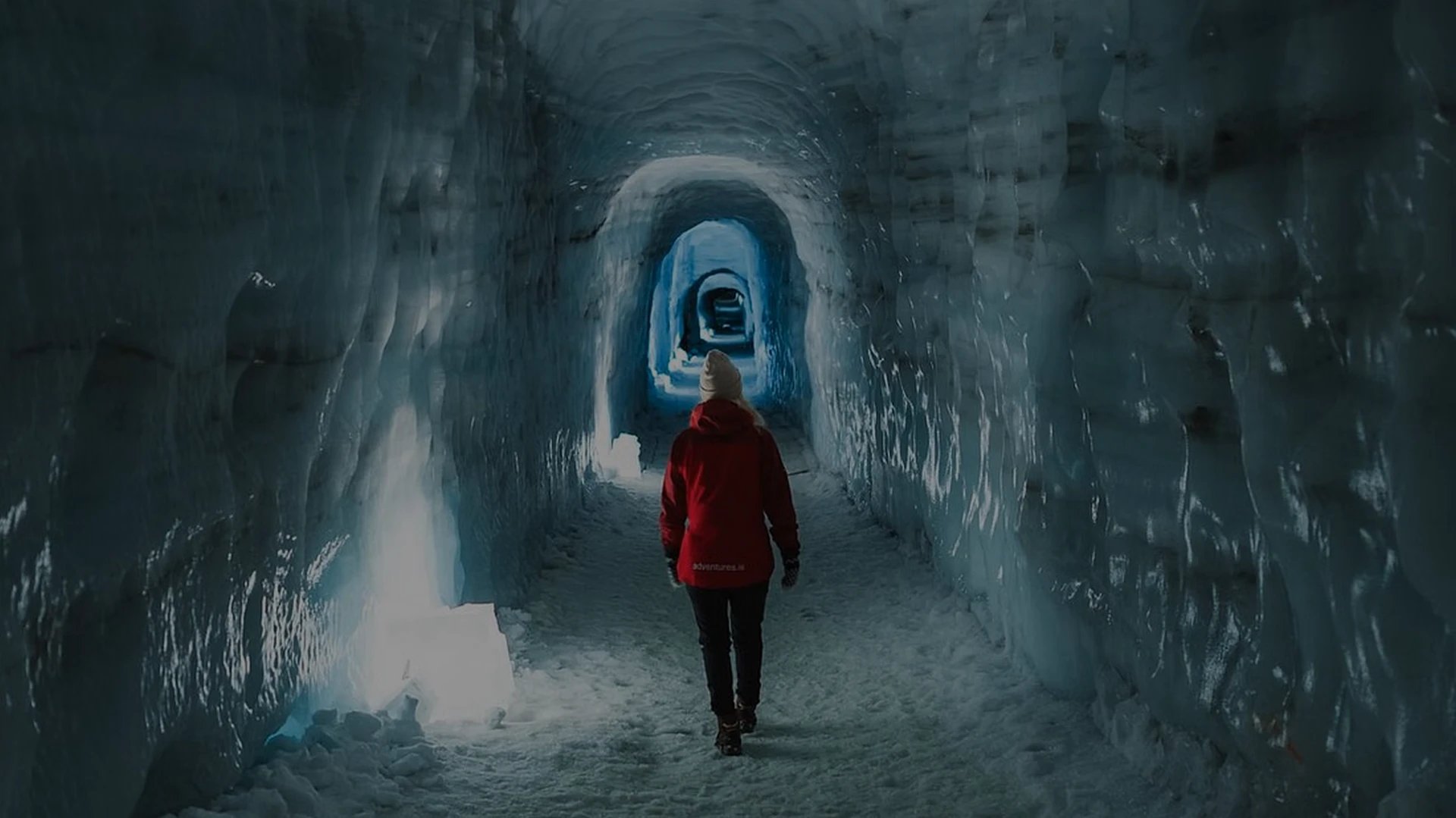 Visitors exploring the spectacular ice tunnels inside Langjökull Glacier