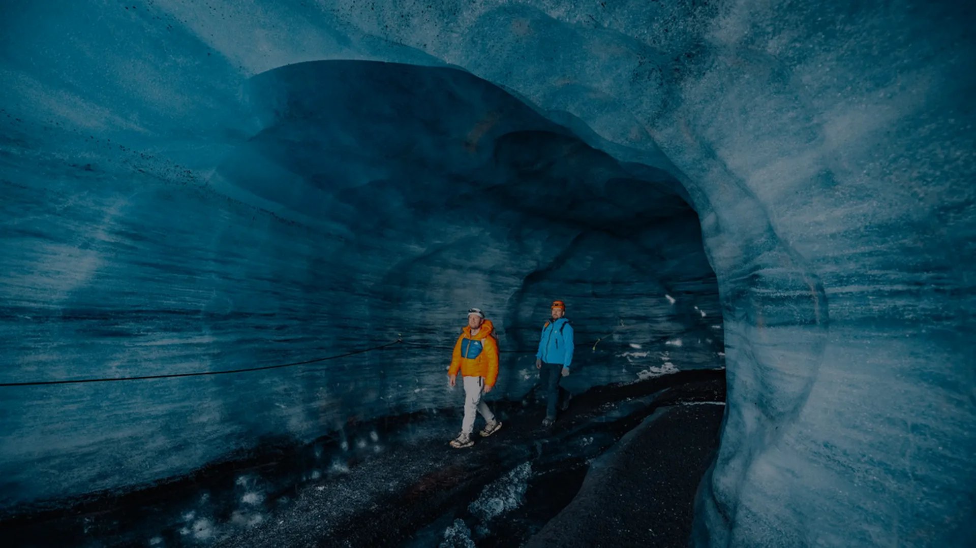 Explorer in Katla ice cave beneath Mýrdalsjökull glacier