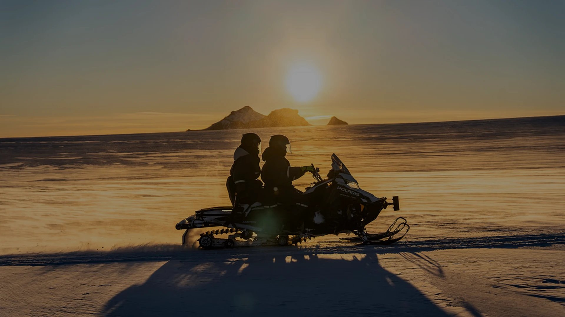Group of snowmobiles on pristine Langjökull glacier surface