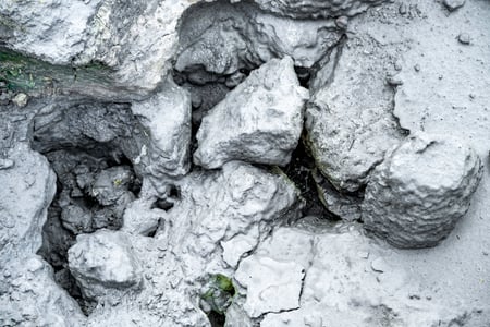Closeup of rocks covered with mud in Seltún