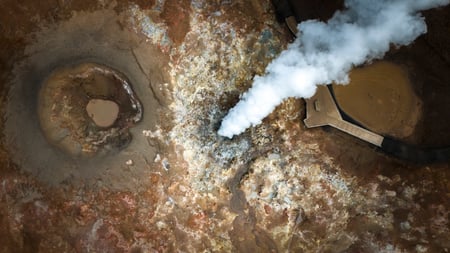 The rocks around Gunnuhver covered in sulfur, iron and silica deposit
