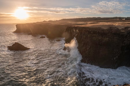 The cliffs of Arnarstapi hit by the waves at sunset on the Snæfellsnes Peninsula
