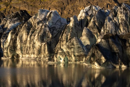 The edge of a magnificent glacier, ready to break, photographed at sunset