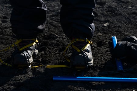 Close up of crampons as they are worn prior to a glacier hike tour