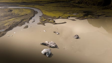 The glacier of Sólheimajökull and the people about to go hiking on it