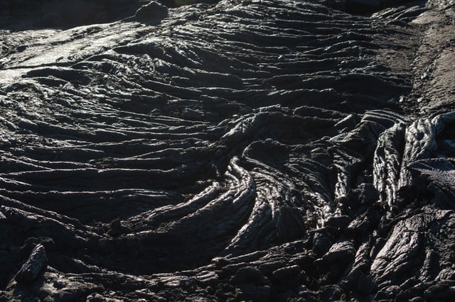 Ripples of black, solidified lava field