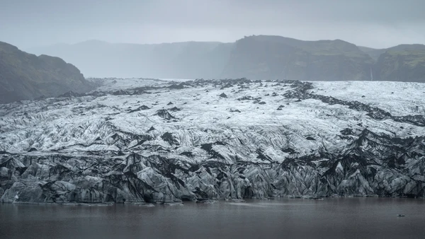The mouth of the mighty glacier of Sólheimajökull on a misty day
