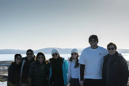 People lightly dressed in front of Gullfoss