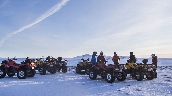 Group of ATV adventurers with Bláfjöll Mountains backdrop
