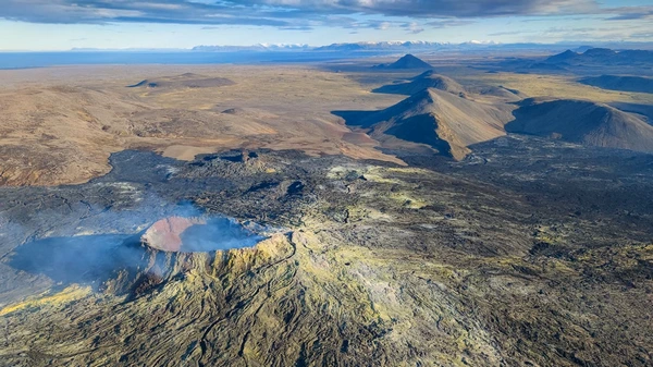 Spectacular aerial view of volcanic crater and lava lake