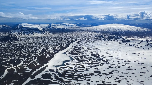 Close-up of ancient ice formations and crevasses during glacier landing