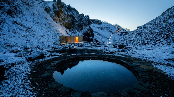 Hot springs nestled inside of a canyon in Húsafell