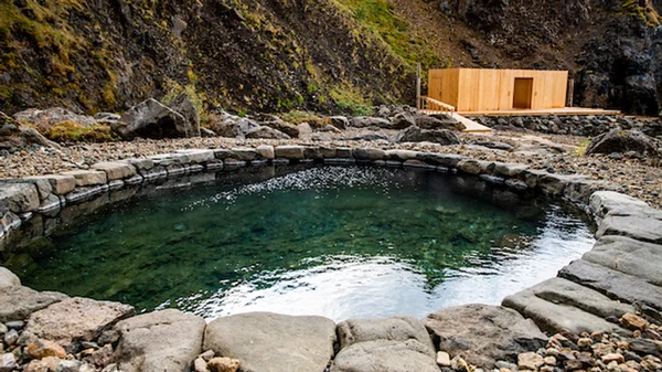 Natural geothermal pools surrounded by pristine wilderness landscape