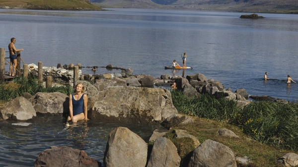Natural oceanside hot springs with dramatic coastal mountain views