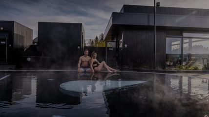 Panoramic view of Krauma spa pools surrounded by West Iceland landscapes