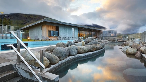 Fontana Spa overlooking Lake Laugarvatn with steam rising