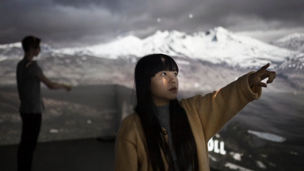 Interactive volcanic eruption display with visitors learning