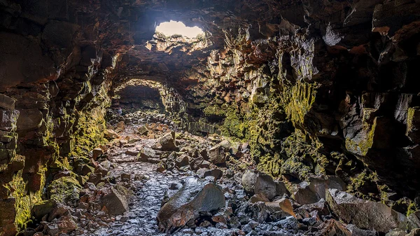 Colorful mineral deposits on lava tunnel walls