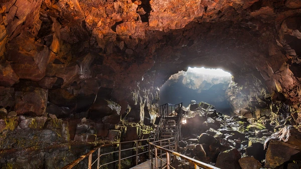 Dramatic lava tunnel passage with textured volcanic walls