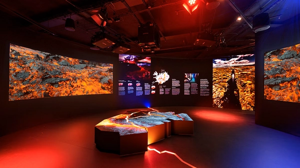 Visitors exploring the indoor ice cave replica at Perlan Museum