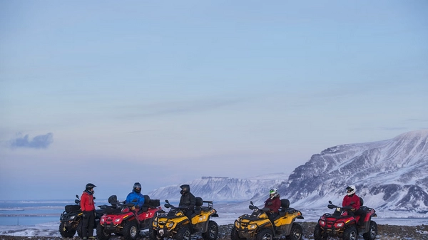 ATV riders ascending Hafrafell mountain with dramatic landscape views