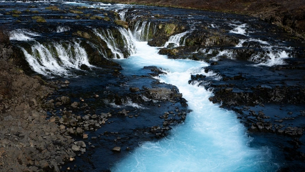 Stunning blue waters of Brúarfoss waterfall