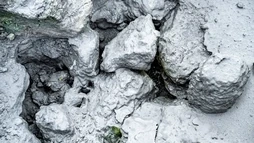 Closeup of rocks covered with mud in Seltún
