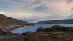 The lake of Laugarvatn and its hot spring photographed at sunset