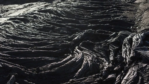 Ripples of black, solidified lava field