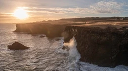 The cliffs of Arnarstapi hit by the waves at sunset on the Snæfellsnes Peninsula
