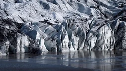Beautiful details of ice on the edge of water in Sólheimajökull