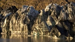 The edge of a magnificent glacier, ready to break, photographed at sunset